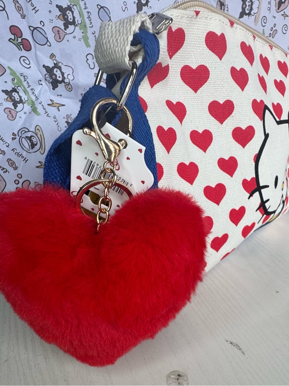 Hello Kitty Canvas Crossbody Bag in Red, Blue, Cream with Plush Red Heart Charm - Picture 5 of 8